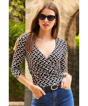 REASONS TO BUY:

A nice top for day or night
Made from soft jersey for comfort and style
Unique geometric print
Made-to-flatter wrap front
Figure-hugging fit - tuck it in or out
Perfect with white bootcut jeans.
