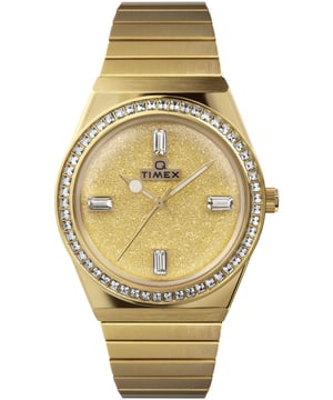Dit Timex Q Reissue Analoge Horloge voor Dames is het perfecte sieraad om te dragen of cadeau te geven. De gouden 36 mm ronde kast, gecombineerd met de comfortabele gouden roestvrijstalen horlogeband, zorgt ervoor dat je kunt genieten van dit verbluffende horloge zonder compromissen. Aangedreven door een hoogwaardig kwartsmechanisme en waterdicht tot 5 bar, blijft je horloge tikken. Dit sprankelende sieraad tilt iedere outfit naar een hoger niveau met een glinsterende diamantstof wijzerplaat, een prinses geslepen kristallen bezel en baguette kristallen markeringen. Dit analoge horloge heeft een functie: Luminous Hands. Hoogrwaardige 19 cm lange en 21 mm brede gouden roestvrijstalen band met een expansiearmband. Kastdiameter: 36 mm, kastdikte: 12 mm, kastkleur: Goud en wijzerplaatkleur: Goud.