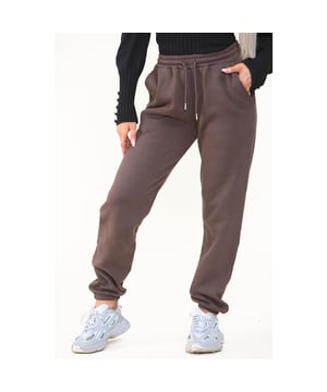 Kruze Womens Relaxed Fit Joggers With Brushed Back Inner Fleece Lining For More Comfort. Featuring 2 Side Slash Pockets, Cuffed Leg Design And Elasticated Waist With Drawstrings. Suitable For Casual Wear.