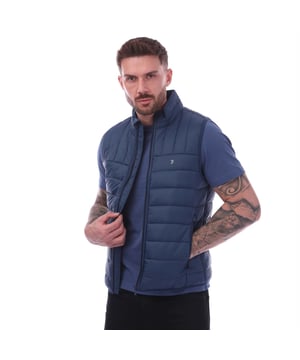 Mens Farah Arsenal Wadded Gilet in dark blue.- Funnel neck collar.- Zip fastening.- Side entry pockets with fleece lining.- Bound hem and armholes.- Embroidered Golf F branding.- Water repellent.- Regular fit.- 100% Polyamide.- Ref: FARFD000978