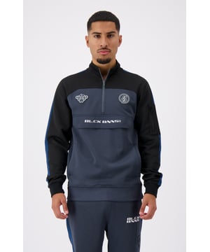 100% polyester Hoge kraag met halve ritssluiting Konvooipad op de borst Zijzak met ritssluiting op de linkerarm BLCK BNNS kenmerkende klep Twee voorzakken met ritssluiting Gestreepte mouwen Kan worden gecombineerd met RUMBLE TRACKPANTS 