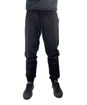 Givenchy BM505Q110H 001 Sweatpants. Sweatpant Bottoms With Elasticated waistband and ankles. Back Pockets. antique gold-finish metal 4G buttons on the side pockets. Brand logo printed on drawsting waist adjusters. 100% Black wool and mohair jogging pant
