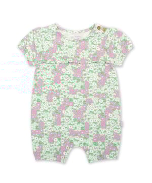 95% organic cotton 5% elastane | Proud to be certified to the Global Organic Textile Standard (GOTS) | Flower patch all-over print | Slub jersey with a little stretch (170-180 gsm) | Coconut button shoulder opening | Popper crotch opening | Short sleeved | Short legs | Frill detail at yoke | Made in Turkey | Machine washable at 40 degrees, or at 30 degrees to be kinder to the planet