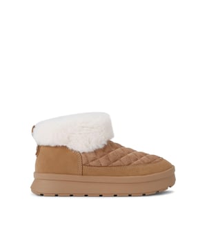 This KG Kurt Geiger Tova ankle boot is crafted in a soft camel microsuede with diamond stitching detail across the upper. The ankle is accented with a faux fur and gold pin stud at the back.