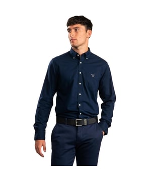 Crafted with Lightweight and Breathable Cotton, these Gant Originals features a Button Down Collar and the Brands Classic Logo on Chest. The Regular Fit Indigo Shirt is a classic preppy essential that will carry you through the warmer months and beyond. GANT OXFORD SHIRT