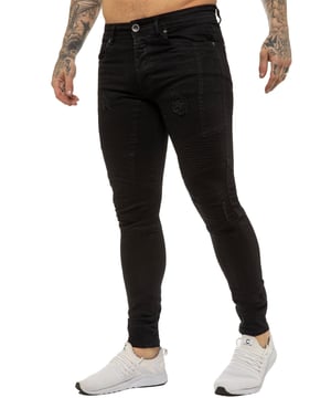 Hecho a medida en denim elástico de algodón para un ajuste súper delgado a través de la pierna, este diseño de 5 bolsillos presenta costuras de motorista en la rodilla, detalles blanqueados y angustiados, un cierre de botón y una pretina con etiqueta de marca de PU negra. Los botones y remaches de marca completan este estilo skinny de tendencia