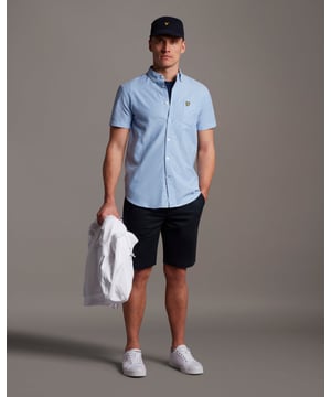 A staple in any man's wardrobe, the Lyle &amp; Scott Short Sleeve Oxford Shirt is a centrepiece of casual and formal looks like. Featuring all the design points of a classic Oxford - button down collar, pointed chest pocket, and 100% durable, wrinkle-resistant cotton - pair it with a tee, layer it with a knit, and wear it with pride.