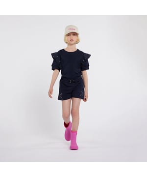 Parisian label Chloé incorporate exquisite materials into their beautifully crafted designs. These girls navy shorts are reflective of the French brand's meticulous construction and preference for whimsical themes. Crafted in organic French terry, they come with pockets in the side seams, yokes featuring eyelets in two colours, an elasticated waistband with a knotted cord and gold embossed tips.  Chloé Embroidery On the Back  100% Organic Cotton
