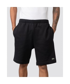 PRODUCT REF. GH9627-00 Efficient. Durable. Comfortable. An iconic, performance-enhancing essential that's comfortable enough to relax in. Regular fit, straight cut: Unrestricted freedom of movement. Drawstring waist: An adjustable waistband for optimum comfort. Piped back pocket: Practical and functional. Stitched crocodile on the front: Lacoste-typical performance. Brushed organic cotton fleece: Long-lasting comfort during training. Main material: cotton (84%), polyester (16%) / pocket lining: cotton (100%)