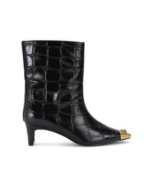 This Kurt Geiger Regent Ankle Boot features a black croc embossed upper with antiqued brass toe cap. There is an antiqued brass eagle head sat on top of the toe all sat on a fashionable kitten block heel. Heel height: 5.5cm.