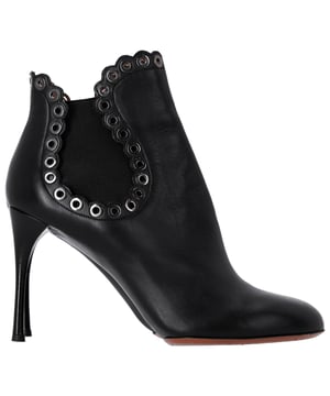 VINTAGE, RRP AS NEW
Step out in style with the Alaïa Eyelet Ankle Boots. These chic ankle booties are a must-have for any fashion-savvy individual. The elastic panel sides offer a comfortable and flexible fit, while the eyelet detailing with scalloped edges adds flair. Complete with high stiletto heels, these boots are the perfect choice for adding a touch of sophistication and confidence to any outfit.

Alaïa Eyelet Ankle Boots in Black Leather
Condition: Very good
Sign of wear: Moderate wear on the soles, marks on the surface, leather creasing
Material: Leather
Color: Black
Size: IT40 / US10 / UK7
SKU: 358070