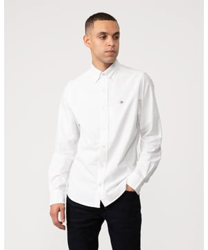 Crafted from a durable cotton Oxford, this slim-fitting shirt features an 80s archive-inspired shield graphic with retro appeal at the chest pocket. Detailed with a button-down collar and a curved hem, this shirt is a preppy essential for any business-casual wardrobe.Slim fit  Chest pocket  Knife pleat with locker loop at back  Adjustable sleeve cuffs&nbsp;Cotton 100%&nbsp;3000202&nbsp;