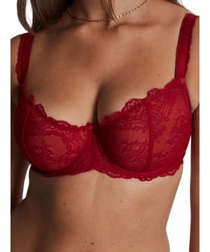Aubade Danse Des Sens Half Cup Bra. With reinforced back construction, lycra lace trim/strip and a satin bow detail. The product is hand-wash only.