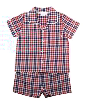 Red Check Cotton Traditional Summer Pyjamas.

A timeless style given the Mini Vanilla treatment, our  Red, Blue & White check pyjama set for boys, is made from beautifully soft crisp summer weight woven 100% cotton and is trimmed with white cotton piping. The top has an open collar and revere, single chest pocket with a MV tab and it fastens at the front with Mini Vanilla engraved buttons.  The crisp cotton comfy shorts have a soft fully elasticated waist.

Sold as a Pyjama set.
Fabric 100% cotton - crisp summer weight.
Fire Warning : KEEP AWAY FROM FIRE AND FLAMES.
Wash Care Instructions : Machine wash inside out, do not soak, wash dark                   colours separately. Save energy and wash at 30 degrees.
Do not tumble dry