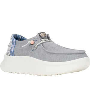 Up your style game with Wendy Peak Chambray Woven. Added, cushy comfort and height meets woven textile heel and webbing details for the perfect mix of comfort and style. So easy to put on you'll never wanna take 'em off.