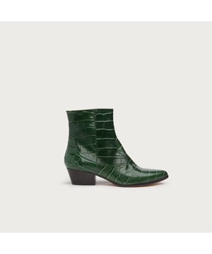 The cowboy boot makes for an unexpected style to be paired with the British heritage fabrics, and it's exactly this juxtaposition that we're having plenty of fun with. Crafted in Italy from honey-toned snake print leather, our Choral cowboy boots have a pointed toe, classic Western styling and a chunky low heel. Wear them with herringbone trousers and a seasonal knit for an eclectic autumnal look.