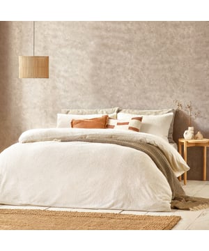 With this incredibly soft all-over boucle duvet cover set, you can turn your home into a cosy cocoon in preparation for the coming winter. Made from wonderfully cosy fabric in a range of relaxing muted tones, this bedding set is perfect for layering textures on your bed for a contemporary, inviting aesthetic.