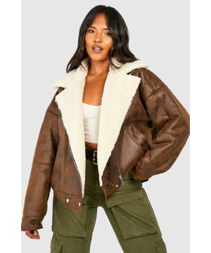 Take your outfit to new style heights with an aviator jacket. Perfect for layering, create a stylish oversized silhouette as you choose from crop belted jackets to faux fur lined options. A cross between a classic flight jacket and a leather biker, it's all about the detailing with this snug winter staple. Pair your aviator coat with high waisted mom jeans and a fierce attitude as you stroll your way through your social calendar.Style: Aviator JacketFabric: WovenLength: RegularNeckline: CollaredSleeve Length: Long Sleeve