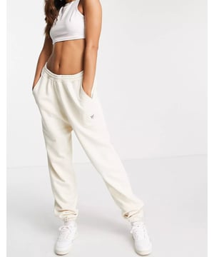 Joggers by Reebok. High rise, stretch waist, side pockets in a relaxed fit.