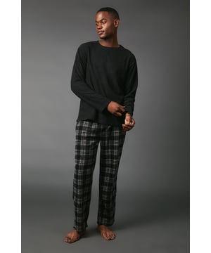 Cosy fleece top with ribbed texture for added warmth
        Classic crew neck design for timeless appeal
        Relaxed fit for ultimate comfort during lounging
        Stylish check pattern pyjama bottoms
        Versatile two-piece set for mix-and-match options
    
    Embrace the art of relaxation with this Maine fleece top and check pyjama set. The ribbed texture of the fleece top not only adds visual interest but also provides extra warmth for those chilly evenings. Paired with the classic check pattern bottoms, this set offers a perfect balance of comfort and style. The relaxed fit of both pieces ensures unrestricted movement, whether you're settling in for a movie night or enjoying a lazy weekend morning. For a change of pace, try wearing the fleece top with your favourite joggers or pair the check bottoms with a plain t-shirt for a different loungewear look. This versatile set is ideal for those who appreciate comfort without compromising on style, making it a must-have addition to your at-home wardrobe.