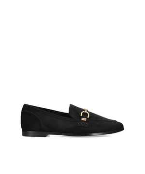 The KG Kurt Geiger Madeline is a black microsuede slip on loafer. There is an antiqued brass horse bit chain across the toe and small KG Kurt Geiger stud.