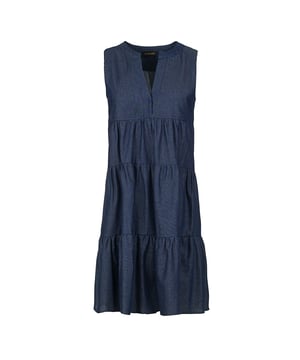 This denim style dress with gathered seams is crafted in woven cotton fabric. It is sleeveless and has a round neckline with a 24cm V opening in the front. There is a press stud on the inside at the bottom of the V to prevent it opening too much. There is oblong shaped double fabric below the V opening in the front. The dress has two 24cm wide ruched panels. There is a double pleat in the back. The dress is styled in a loose A line silhouette and it hits above the knee.