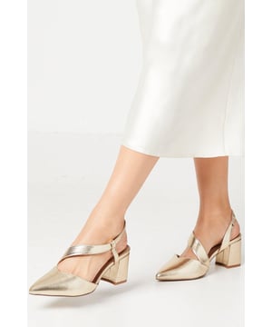 Asymmetric strap design for a modern twist
        Pointed toe silhouette adds elegance
        Block heel between 5 and 6.5cm for comfortable wear
        Wide fit for enhanced comfort
        Versatile day-to-night style
    
    Step out in sophistication with these Wallis Wide Fit Eve Asymmetric Strap Block Heel Court Shoes. The unique asymmetric strap design adds a contemporary flair to the classic pointed toe silhouette, making these shoes a standout choice for the fashion-forward woman. With a comfortable mid-height block heel, they're perfect for all-day wear, transitioning effortlessly from office to evening soires. The wide fit ensures comfort without compromising on style, ideal for those who appreciate a bit more room. Style these versatile courts with tailored trousers and a crisp blouse for a polished work ensemble, or pair them with a sleek midi dress for elegant evening attire. Their neutral hue makes them a wardrobe staple, easily coordinating with a variety of outfits for countless sophisticated looks.