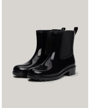 Splash about in style with these patent rain boots, featuring easy elasticated side panels for a classic Chelsea-inspired look.
 
Highlights
• Thermoplastic rubber upper
• Polyester lining
• EVA insock
• Thermoplastic rubber cleated outsole
• Patent finish
• Elasticated side panels
• Pull-on loop
• Tommy Hilfiger branding
• Tommy Hilfiger enamel flag on ankle
 
Shape & fit
• Rain boots
• Pull-on design
• Round toe
• Shaft height 15.5cm
• Sole height 3.6cm
 
Composition & care
• 100% thermoplastic rubber
 
FW0FW08213