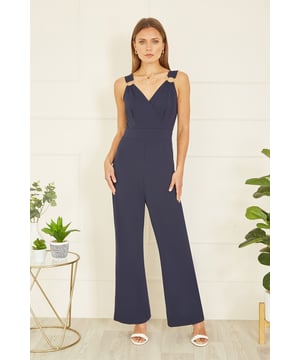 Stay bang on trend at any invite this season in this Mela jumpsuit. The all in one design has been crafted from a stretch fabric to ensure you can be mega stylish and comfortable for those all day events. With a wrap over neckline, and gold buckle details on the straps, finish this flattering wide leg fit with a pair of heels.