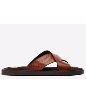 Elevate your summer style with the Astro Sandals by Base London. Crafted for comfort and durability, these sandals feature a grippy rubber sole, plush suede footbed, and exquisite leather cross-over straps. Embrace luxury in every step.Rich detail.- Grippy rubber sole.- Slip-on fit- Leather upper- Soft suede footbed with Ortholite cushioning