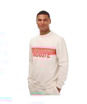 Bold. Colorful. Audacious. A new generation of Active wardrobe. This new style  dedicated to GenZ  have a bold and eye-catching Lacoste print in the middle. Break traditional codes and create a new strong identity with a playful mash up of colors. This sweatshirt is a fashion must-have. Loungewear sweatshirt Regular fit: natural ease on body Lightweight French terry Crew neck Ribbed cuffs and body bottom Bicolor cut and shifted Lacoste branding on chest 