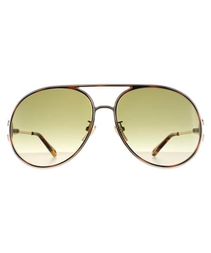 Las gafas de sol Chloe Aviator para mujer en oro, azul y marrón degradado CH0145S son un elegante modelo aviador elaborado en metal ligero. Las almohadillas nasales de silicona y las puntas de las patillas de plástico garantizan la comodidad durante todo el día. El logo de Chloe se presenta en las delgadas patillas para autenticar la marca.