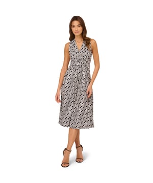 Great for work and for play, this sleeveless dress is a timeless look. This midi dress features a fitted bodice with a v-neckline, a knotted detail at the centre of the waist, and a soft skirt. Crafted from jersey fabric with comfortable stretch, this pull-on day dress boasts a geometric print. Styled with a blazer at the office, this sleeveless dress will take you all the way through happy hour.