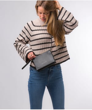 The 'Niki' cross body bag from the Pure Luxuries Marylebone collection is handcrafted from high-quality, genuine Nappa leather with a natural super-soft touch. The zip-over top opens to reveal a 100% cotton-lined interior. The spacious interor features three divided sections, a slip pocket and three card slots. The slip pocket on the rear of the bag provides on-the-go storage and comes with a matching and adjustable slim leather strap with a maximum drop length of 65cm. The Pure Luxuries logo is embossed in gold foil for a beautifully simple finishing touch.