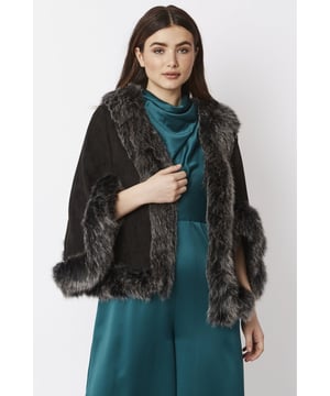 Immerse yourself in effortless luxury with this elegant, decadent faux suede cape with matching faux fur trim. Our luxurious cape can be worn to complete a modern layered look on those chilly days.