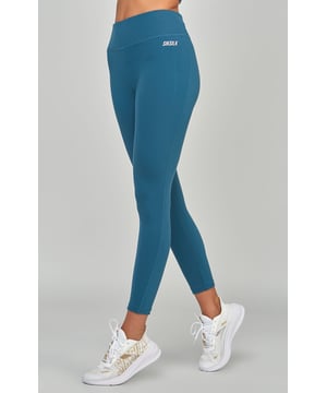 inchTeal Sports Essentials LeggingContains 30% recycled polyesterSoft touchHigh riseHigh build print logoSecure back zip pocketFlat seams for comfortMoisture wicking fabricMachine wash82% Polyester  18% Elastane inch