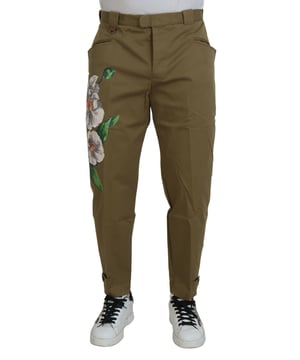 Brand: Dolce & Gabbana
  Model: Chino pants
  Color: Beige with multicolor floral
  Material: 93% Cotton 2% Elastane 5% Capra
  Button closure
  Two front pockets
  Two back pockets
  Logo details
  Made in Italy
Material: 93% Cotton 2% Elastane 5% Capra