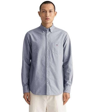 Crafted with Lightweight and Breathable Cotton, these Gant Originals features a Button Down Collar and the Brands Classic Logo on Chest. The Regular Fit Oxford Shirt is a classic preppy essential that will carry you through the warmer months and beyond.