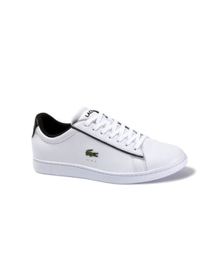 These trainers effortlessly blend classic design elements with contemporary flair, making them a versatile choice for any modern gentleman.

Crafted with a premium white leather upper, these trainers showcase the brand's commitment to quality and attention to detail. The clean and sleek design is complemented by subtle perforated detailing, adding a touch of texture and visual interest.

The low-top silhouette offers a refined and versatile look that easily pairs with various outfits, from casual to semi-formal. The iconic Lacoste crocodile logo on the side adds a signature touch, representing the brand's heritage and timeless style.

Equipped with a cushioned insole, these trainers provide exceptional comfort and support for all-day wear. The lace-up closure ensures a secure and adjustable fit, while the padded collar adds an extra layer of comfort around the ankle.

Built for both style and functionality, these trainers feature a durable rubber outsole that offers reliable traction on different surfaces. Whether you're strolling through the city or enjoying a casual outing, these trainers provide stability and grip with every step.

Embrace the effortless elegance of the Lacoste Carnaby Evo 120 2 SMA Men's White Trainers. Whether you're dressing up for a special occasion or adding a touch of sophistication to your everyday look, these trainers are the perfect choice. Step into refined style and enjoy the combination of comfort, quality, and timeless design that Lacoste is renowned for.