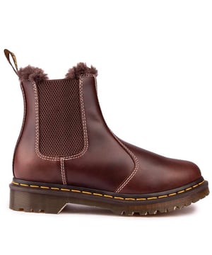 The Sleek Dr. Martens 2976 Leather Chelsea Boot Features An Elasticated Gusset And The Signature Airwair Heel Loop. These Women's' Boots Have N Overspilling Faux Fur Lining, The Unmistakable Doc's Dna Like The Iconic Yellow Stitching, The Airwair Sole, Goodyear Welted And With A Rugged Tread. An Uncompromised, Timeless Style That Never Goes Out Of Fashion.
