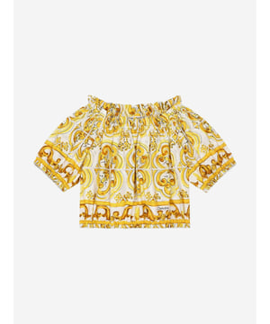 Dolce & Gabbana utilise new technological properties to create captivating aesthetics. This girls blouse is a part of the FW24/25 Girl‚  Collection. Depicted in Majolica, a symbol of Italian craftsmanship, it comes in lemon yellow, brightened up by pure white, taking inspiration from Sicilian pottery. Envisioned in cotton poplin with all-over yellow majolica print via a cropped fit and short puff sleeves, showcasing elasticated cuffs.  Made in Italy Boat Neck With Dropped Shoulders Stretch Hem Placed Print Due to "Handmade" Aspect 100% Cotton