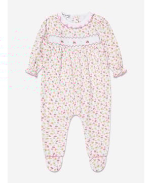 Magnolia Baby depict soft sophistication into their refined products. This baby girls pink babygrow is reflective of the label's precision of beauty and intricate focus. Made in Pima cotton with floral patterning, ruffled trims and embroidered detailing. She will look and feel divine. Crew Neck  Brand Tag Floral Patterning  Press Stud Fastening Long Sleeves  Ruffled Trims Pima Cotton  Embroidered Detailing