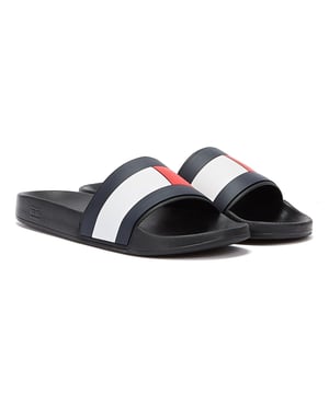 These Rubber TH Flag Pool Slide by Tommy Hilfiger are classic rubber pool slide in black created with rubber mix blend and finished with Tommy Hilfiger flag branding on the wide strap witch sits on a curved footbed for ultimate comfort.