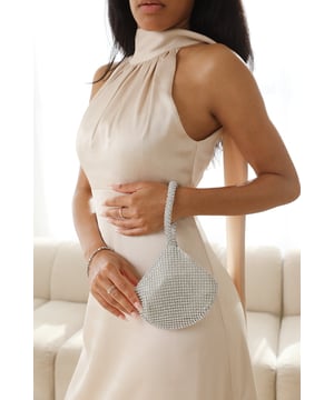 Get ready to dazzle and shine with our Rosa mini chainmail pouch bag. This exquisite bag combines elegance with a touch of glamour, perfect for making a statement at any special occasion.Key Features:



Dazzling Design: The mini chainmail construction of this pouch bag is adorned with shimmering diamante crystals. The intricate pattern and sparkling embellishments create a mesmerizing effect that will capture everyone's attention.

Compact and Portable: This mini pouch bag is designed to hold your essentials while keeping you stylishly organized. It comfortably fits your phone, keys, lipstick, and other small items, making it perfect for a night out or a special event.

Secure Closure: The pouch bag features a secure zippered closure to keep your belongings safe and secure throughout the day or evening. You can enjoy your event without any worries about accidental openings.

Premium Quality: Crafted with attention to detail and using high-quality materials, this bag is built to last. The sturdy construction ensures durability and longevity, allowing you to enjoy the bag for many occasions to come.


Specifications:


Material: Chainmail with diamante crystals
Closure: Zippered closure

Add a touch of glamour and sophistication to your ensemble with our Rosa mini chainmail pouch bag. Its dazzling design and versatile styling options make it the perfect accessory to elevate your look and express your unique sense of style. Get ready to sparkle and shine with this stunning bag.
