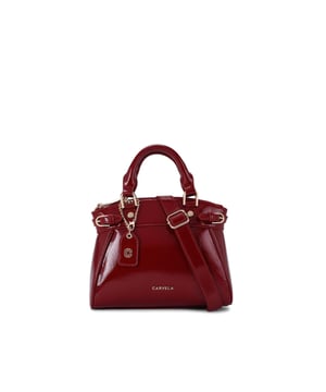 This Carvela Mini Valentina Tote bag features a wine red exterior in a trapeze style. There are two buckled straps across each side of the bag and branded gold tone hardware across the bag. Dimensions: 19cm (H), 22cm (L), 10cm (D). Strap length: 111cm.