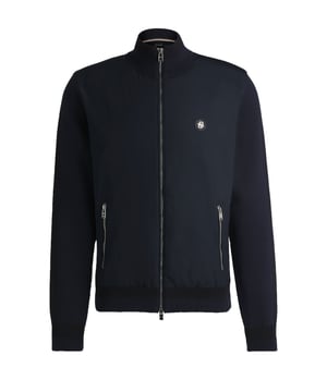 Boss C-Darmando Mixed-material Zip-up Jacket Dark Blue
 
A signature zip-up jacket, cut to a straight fit and crafted in mixed materials for ultimate style and performance. Finished with the all new double-monogram badge at the chest.

Regular fit
Ribbed cuffs
Standard length
Quality: 100% Cotton, Sleeve: 71% Cotton, 29% Polyester, Front panel: 100% Polyester, Front lining: 100% Polyester, Ribbing: 79% Cotton, 21% Polyester, Wadding: 100% Polyester (80% recycled)