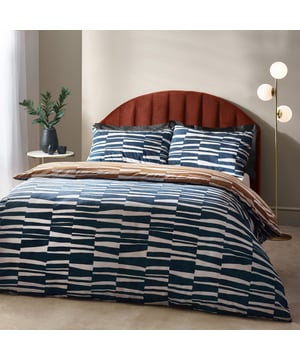 Go to sleep in style with the Piper duvet cover set, inspired by modern, minimalist and abstract art. Create an impact with this modern design, adorned with striking irregular stripes in a tone reminiscence of dusk skies. The reverse features a coordinating print in warming bronze, to offer an alternative design when you need a midweek refresh. A thoroughly modern classic, with a forward-thinking design which will add sophisticated style to your interior. This product is certified by OEKO-TEX® showing it has been sustainably made.