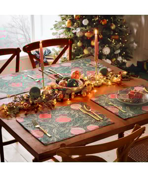 Displayed in all its glory, the Pomegranate set of four placemats is the perfect addition to your home this festive period. Digitally printed for exceptional clarity on a durable woven polyester fabric, the opulent, juicy fruits intertwine with gold leaves, complimenting the warming green background. A refreshing alternative to traditional festive decor, this beautiful set brings richness to the Christmas dining table and will look fantastic all year-round.