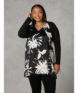 Details

Satin front
Jersey long sleeves
Woven layered pleat detail back
High low hemline
V-Neckline

Garment Care

Composition: Main - 75% Polyester 25% Elastomultiester , Back - 100% Polyester, Sleeves - 95% Viscose 5% Elastane
Cool machine wash at 30 degrees

Sizing

Model height: 5ft 10inches/178cm
Length from back neck to hem: 87cm


In classic black, this tunic has a silky satin front with a stone floral print, and full-length jersey sleeves for comfort. The back is cut from a pleated, draping chiffon, with two layers for that all-important coverage. It has a lengthening V-neck, as well as a high-low hemline which creates a flattering silhouette. Dress this top up or down, depending on your plans.
