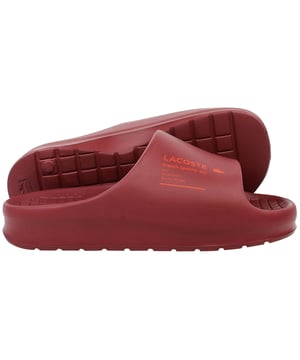 The Lacoste Serve Slide 2.0 223 2 CMA Men's Red Sliders deliver bold style and everyday comfort, making them an essential choice for casual wear, poolside relaxation, or beach outings. With their vibrant design and premium construction, these sliders offer practicality and flair.
Â 
Key Features:
Ergonomic Footbed: 

Contoured for superior comfort and support, providing a comfortable fit for extended wear.


Durable Synthetic Strap: 

Features the iconic Lacoste crocodile logo embossed for a sporty and stylish look.


Slip-On Design: 

Ensures easy on-and-off wear, making them perfect for leisure and quick outings.


Textured Rubber Outsole: 

Offers reliable grip and traction on various surfaces, even in wet conditions.


Lightweight Construction: 

Reduces fatigue, ensuring comfort for all-day use.


Water-Resistant Materials:

Designed to withstand exposure to water, making them ideal for pool or beach environments.


Bold Red Colorway: 

A striking and energetic design that adds a vibrant touch to your casual wardrobe.


Â 
The Lacoste Serve Slide 2.0 223 2 CMA Men's Red Sliders combine comfort, durability, and a bold aesthetic, making them a go-to option for relaxed and stylish footwear. Perfect for vacations, lounging, or adding a pop of color to your everyday look.
Â 
Â 
Â 